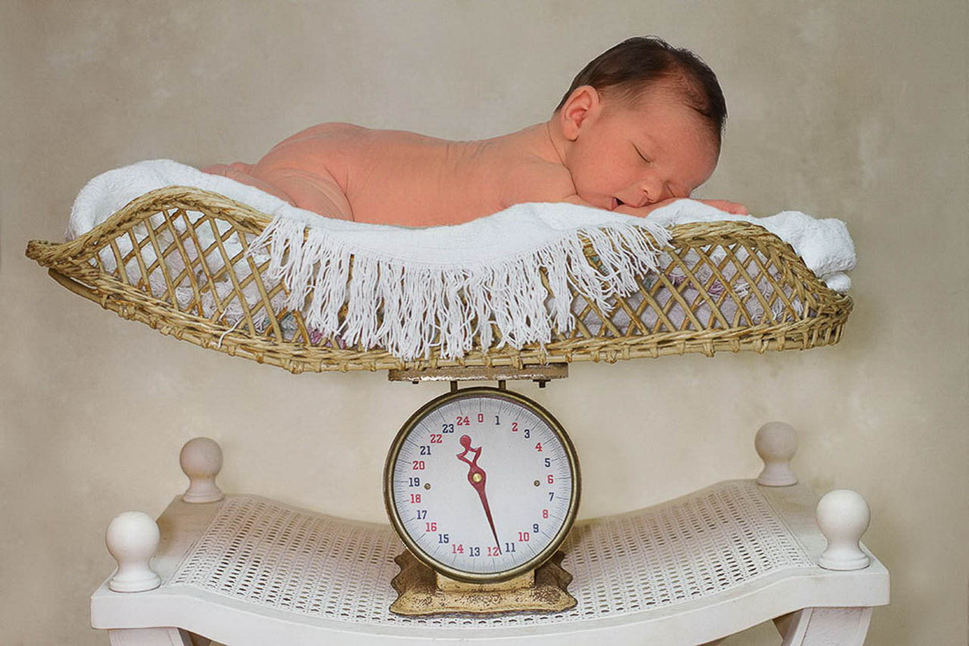 Baby boy photographed on a digital scale with his actual weight at birth 11 and one half pounds