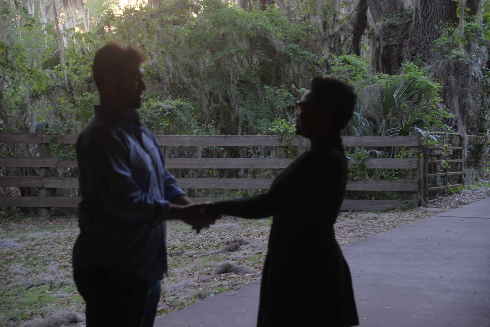 Engaged couple holding hands together after an outdoor marriage proposal in Gainesville, Florida.