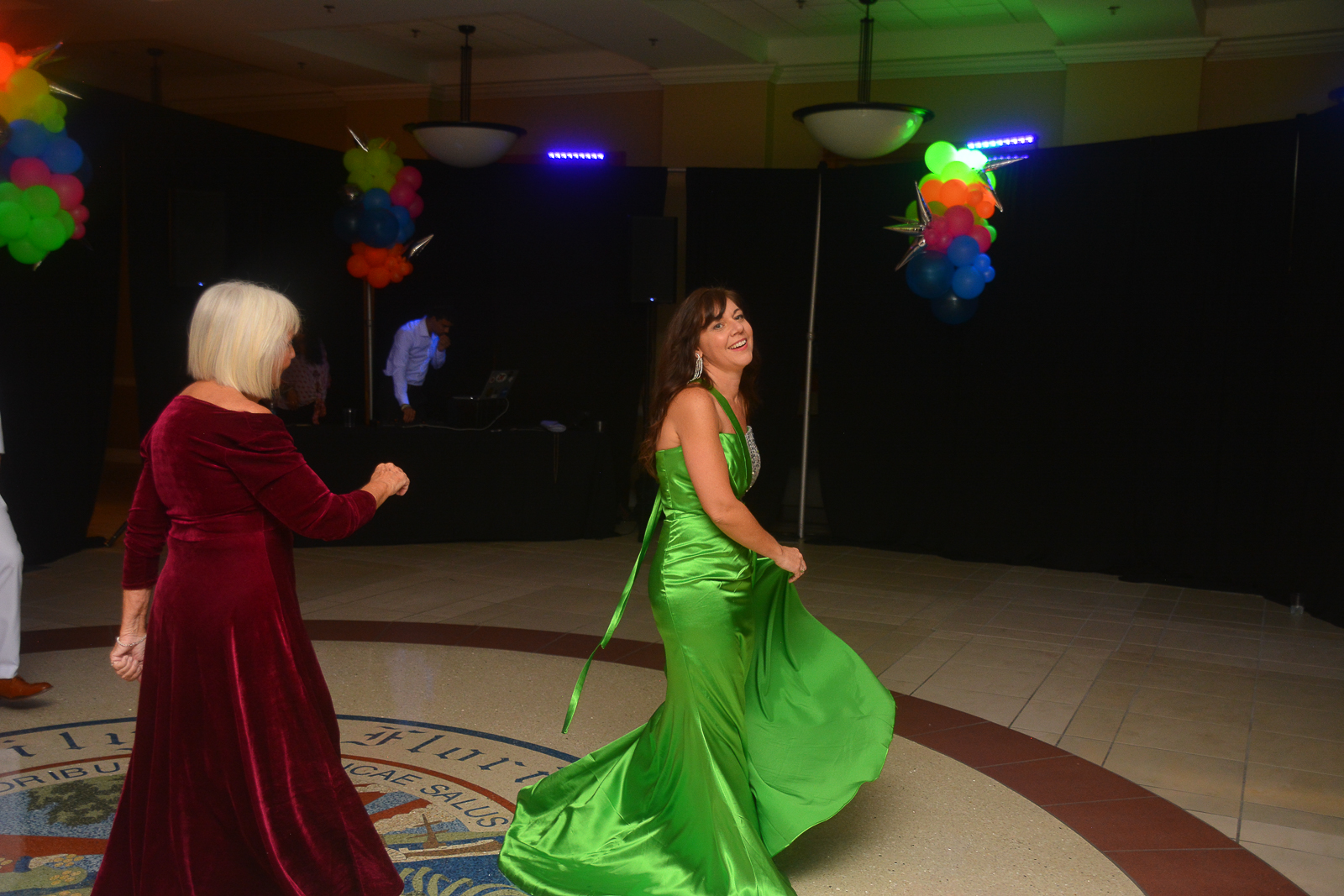 Two women dancing at the Xtraordinary Joy event in Gainesville, Florida.