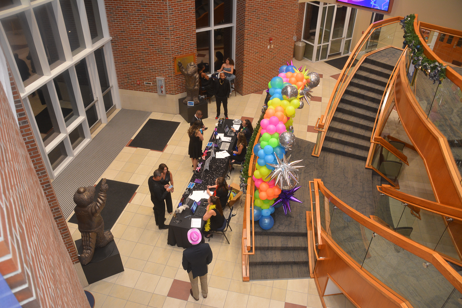 Guests checking in at the Extraordinary Joy event registration table in Gainesville, Florida.